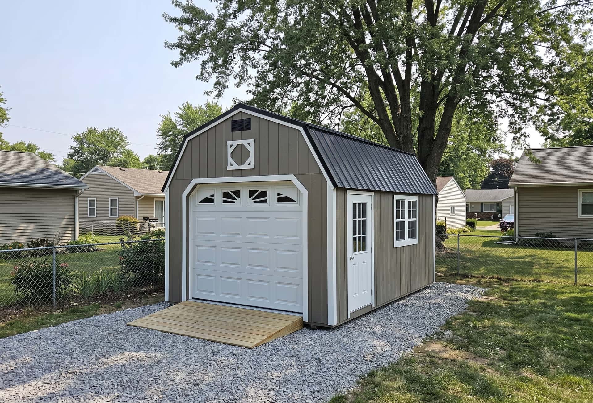 Amish-built LP SmartSide lofted garage with sunburst gable accent on a Michigan property